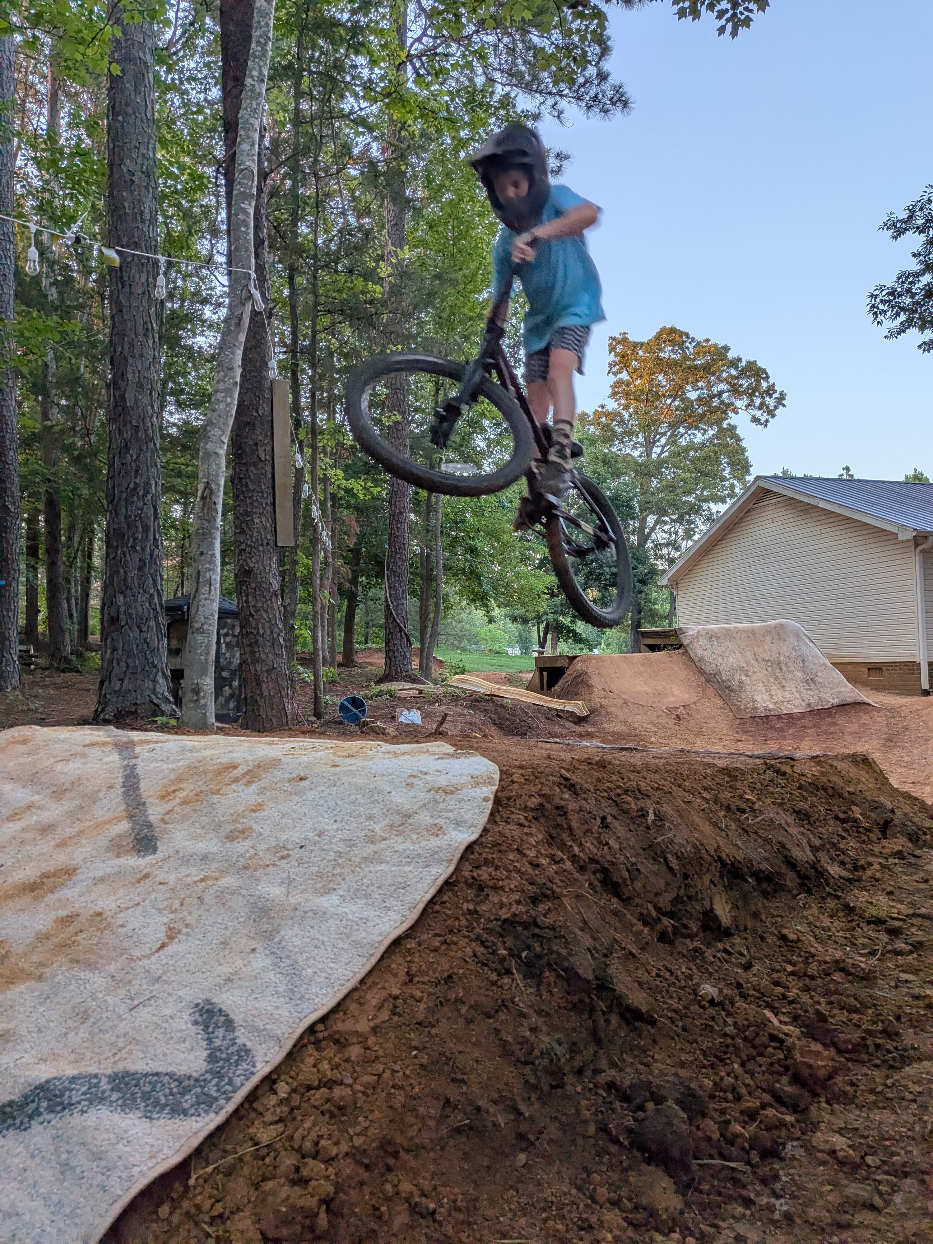 Young rider learning to jump with a full-face helmet